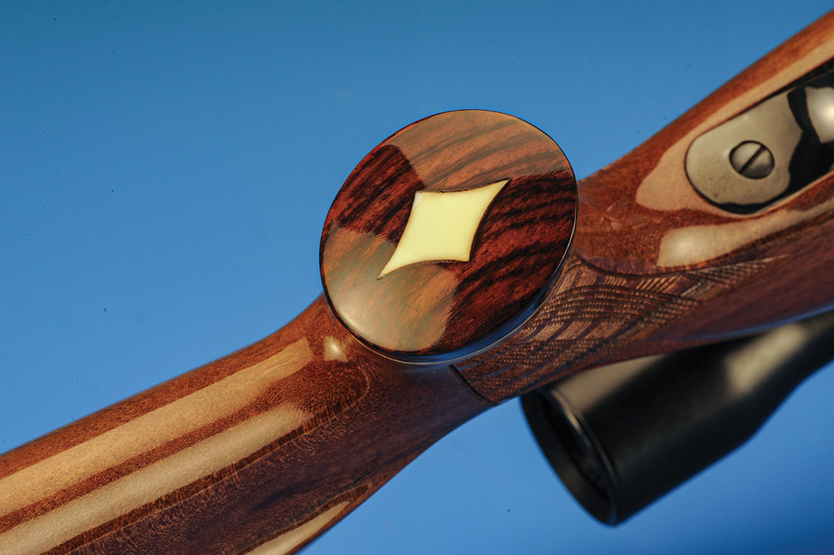 Roy Weatherby carried many of these design features, like the rosewood tip and inlay on the grip cap, from his Mark V rifle onto the Mark XXII.